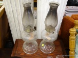 PAIR OF VINTAGE GLASS OIL LAMPS; CLEAR GLASS CHIMNEYS AND GLOBES WITH FLARED FLUTED BASES. EACH
