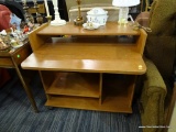 ROLLING COMPUTER DESK; MEDIUM WOODGRAIN LAMINATE FINISH, KEYBOARD PLATFORM EXTENDS OUT OVER THE