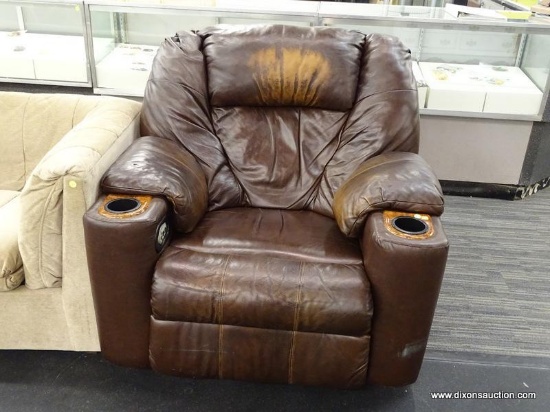 OKIN LIFT CHAIR; BROWN LEATHER UPHOLSTERED LIFT CHAIR WITH DUAL CUP HOLDERS AND REMOTE. HAS SOME