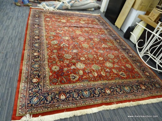 HAND KNOTTED KERMAN DESIGN ORIENTAL RUG. HAS SOME DAMAGE. MEASURES 13 FT 4 IN X 9 FT 4 IN. PRIMARILY