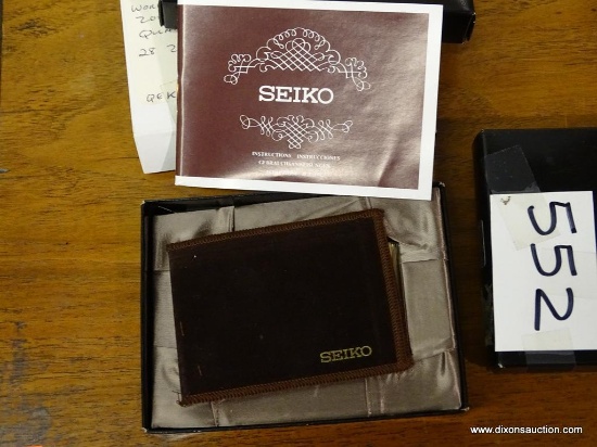 SEIKO WORLD TIME CLOCK; IN ORIGINAL BOX. WORLD TIME DIGITAL ALARM CLOCK HAS A STAND BUILT-IN TO THE