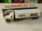 HESS 18 WHEELER; COMES WITH A RACER AND IS IN THE ORIGINAL BOX. APPEARS TO BE NEVER USED!