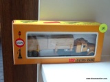 COX LUMBER TRUCK; COX TRUCK WITH FLATBED TRAILER AND 2 LUMBER LOADS. BRAND NEW IN THE BOX!