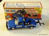 MOBIL TOY TRUCK; MOBIL COLLECTIBLE TOY TOW TRUCK 3RD IN A SERIES (1995). HAS WORKING HEAD AND TAIL