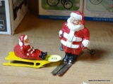 (CNTR) LEAD SANTAS; PAIR OF LEAD FIGURINES DEPICTING SANTA (1 SKIING AND 1 SLEDDING)