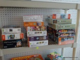 (WALL) PUZZLE LOT; INCLUDES APPROXIMATELY 15 TOTAL PUZZLES. SOME ARE 300 PIECES AND SOME ARE 500