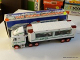 HESS TOY TRUCK AND RACERS; IN THE ORIGINAL BOX AND APPEARS TO BE NEVER USED!