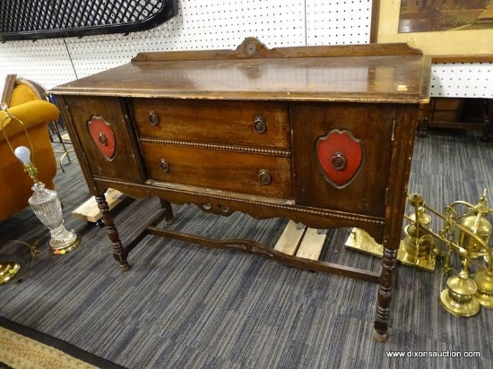 SIDEBOARD; 2 DOOR AND 2 DRAWER SIDEBOARD WITH RING STYLE PULLS ON THE DOORS AND DRAWERS. HAS A