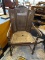 ANTIQUE TRIPLE PANEL CANE WINGBACK CHAIR; WOODEN CARVED FRAME WITH PATTERNED CREST, 3 PANELED BACK