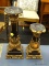 CANDLE HOLDERS; PAIR OF GOLD TONED AND BLACK PAINTED CANDLE HOLDERS. 1 MEASURES 13 IN TALL AND 1