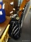 NIKE GOLD BAG AND CLUBS; BLACK, WHITE, AND NAVY NIKE GOLF BAG. THIS BAG HAS 5 ZIPPERED POCKETS, A