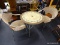 NATURAL WICKER OUTDOOR AND TABLE CHAIRS; THIS LOT INCLUDES AN OUTDOOR TABLE THAT HAS A ROUND STONE