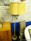 VINTAGE FLOOR LAMP; THIS FLOOR LAMP HAS A CREAM COLORED PLEATED SHADE WITH GOLD ROPE TRIM ON THE TOP