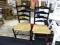 SET OF RUSH BOTTOM SIDE CHAIRS;BLACK LADDERBACK SIDE CHAIR WITH GOLD LEAF DETAILING ON TOP RAIL,