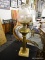 BRASS TABLE LAMP; FROSTED AND ETCHED GLASS GLOBE WITH RUFFLED TOP EDGE AND NARROW NECK, SITTING ON A