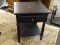 THOMASVILLE END TABLE; BLACK END TABLE MADE BY RENOVATIONS BY THOMASVILLE. THIS TABLE HAS A PULL OUT