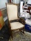 VINTAGE UPHOLSTERED WOODEN ROCKER; WOODEN ROCKING CHAIR WITH CREAM COLORED UPHOLSTERED BACK AND SEAT