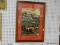 FRAMED COUNTRY TOWN PUZZLE; THIS IS PUZZLE BY HERONIM. IT DEPICTS AN OLD TOWN IN THE ROLLING HILLS.