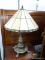 FAUX STAINED GLASS TABLE LAMP; CARVED FINIAL ON TOP OF A FAUX STAINED GLASS SHADE WITH CREAM COLORED