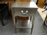 BLACK SINGLE DRAWER SIDE TABLE/NIGHTSTAND; HAS 1 CENTER DRAWER WITH A SILVER TONED PULL AND