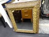 HEAVY ORNATE BRASS FRAMED MIRROR; TIERED FRAME WITH HEAVILY ORNAMENTED DESIGN, MEASURES 25 IN X 29