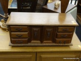 WOODEN JEWELRY CHEST; 3 DRAWERS TO THE LEFT AND RIGHT OF A PANELED DOUBLE DOOR CENTER CABINET WHICH