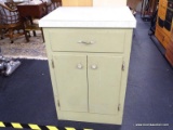 LAMINATE TOP GREEN CABINET. THIS VINTAGE WHITE AND GREEN LAMINATE TOP CABINET HAS A SAGE GREEN BASE