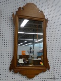 CHIPPENDALE WOOD FRAMED WALL MIRROR; BOWED TOP WITH CARVED DESIGN ON EACH SIDE, MOLDED BORDER AROUND