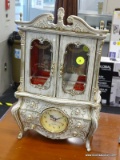 MUSICAL JEWELRY CHEST; WHITE IN COLOR WITH A FRENCH PROVINCIAL DESIGN. HAS 2 GLASS FRONT DOORS WITH