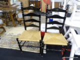 SET OF RUSH BOTTOM SIDE CHAIRS;BLACK LADDERBACK SIDE CHAIR WITH GOLD LEAF DETAILING ON TOP RAIL,