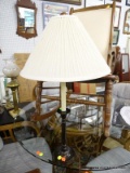CANDLESTICK STYLE TABLE LAMP; THIS TABLE LAMP HAS A CREAM COLORED PLEATED BELL SHAPED SHADE WITH