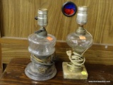 SET OF GLASS TABLE LAMPS; THIS LOT CONTAINS TWO GLASS LAMPS. ONE IS AN ELECTRIFIED OIL LAMP AND THE