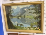 FRAMED PHOTOGRAPH; DEPICTS A MAN AND A HORSE STANDING ALONG AN EMBANKMENT IN A VALLEY. IN A GOLD