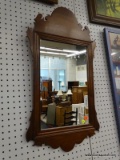 WOOD FRAMED WALL MIRROR; MEDIUM SIZED RECTANGULAR CHIPPENDALE WALL MIRROR FRAMED IN A CARVED WOOD