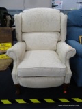 CREAM UPHOLSTERED LAY-Z-BOY RECLINER; THIS CREAM COLORED, FAN DETAILED WINGBACK RECLINER IS MADE BY