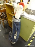 WILSON GOLF BAG AND CLUBS; NAVY BLUE AND SILVER WILSON GOLF BAG WITH SIDE CARRYING STRAP AND 2