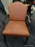 RED/ORANGE UPHOLSTERED SIDE CHAIR; THIS CHAIR HAS A PADDED ARCHED BACK AND SEAT WHICH ARE
