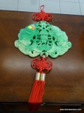 JADE COLORED KOI FISH WALL MEDALLION WITH RED TASSELS; MEASURES 11.5 IN WIDE AND IS 32 IN TALL FROM