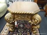 LARGE ORNATE GOLD AND BROWN CARVED END TABLE; OCTAGONAL TOP SURFACE WITH ROPED TRIM, INTRICATELY