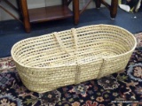 BRAIDED GATHERING BASKET; OBLONG 2 HANDLED BRAIDED BASKET. MEASURES 32 IN X 18 IN X 9 IN. GREAT FOR