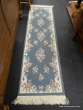 FRINGED HALLWAY RUNNER RUG; MACHINE WOVEN, LIGHT BLUE WITH CREAM COLORED TRIM AND FRINGE AND PINK
