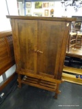 MISSION-STYLE ENTERTAINMENT CABINET; FLAT TOP SURFACE OVER A PAIR OF PANELED DOORS WITH SLIDING
