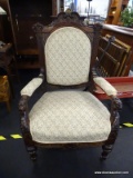 HEAVILY CARVED ARMCHAIR WITH FLORAL UPHOLSTERY; ORNATE RENAISSANCE REVIVAL REPRODUCTION CHAIR WITH