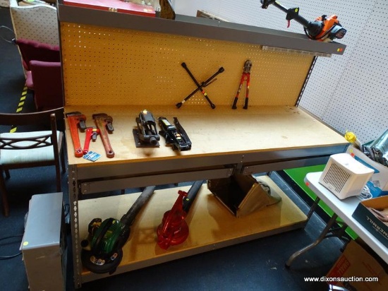 LARGE WORKBENCH; IS GRAY IN COLOR. HAS AN UPPER STORAGE SHELF, PEGBOARD BACK, PRESSED WORKTOP, 2