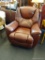 LEATHER LA-Z-BOY RECLINER; RICH BURGUNDY LEATHER RECLINER, HAS SOME NATURAL WEAR NEAR THE HEADREST,