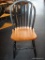 BOW BACK SIDE CHAIR; BLACK PAINTED AND WOODEN PLANK BOTTOM BOW BACK SIDE CHAIR. MEASURES 18 IN X 18