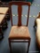 STRAIGHT BACK SIDE CHAIR; HAS A FLORAL CROSS-STITCHED SEAT AND MEASURES 17 IN X 15 IN X 38 IN