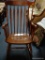 ROCKING CHAIR; VINTAGE ARROW BACK AND PLANK BOTTOM ROCKING ARMCHAIR. MEASURES 24 IN X 28 IN X 40 IN.