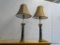 PAIR OF BRASS COLUMN STYLE LAMPS; SET OF TWO RED SQUARE SHAPED SHADE SITTING ON A BRASS AND BLACK