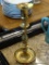 TURNED BRASS CANDLESTICK; ON ROUND BASE, MEASURES 11 1/4 IN TALL.